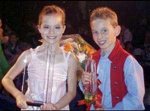 Tade Holding Trophy From a Dance Competition